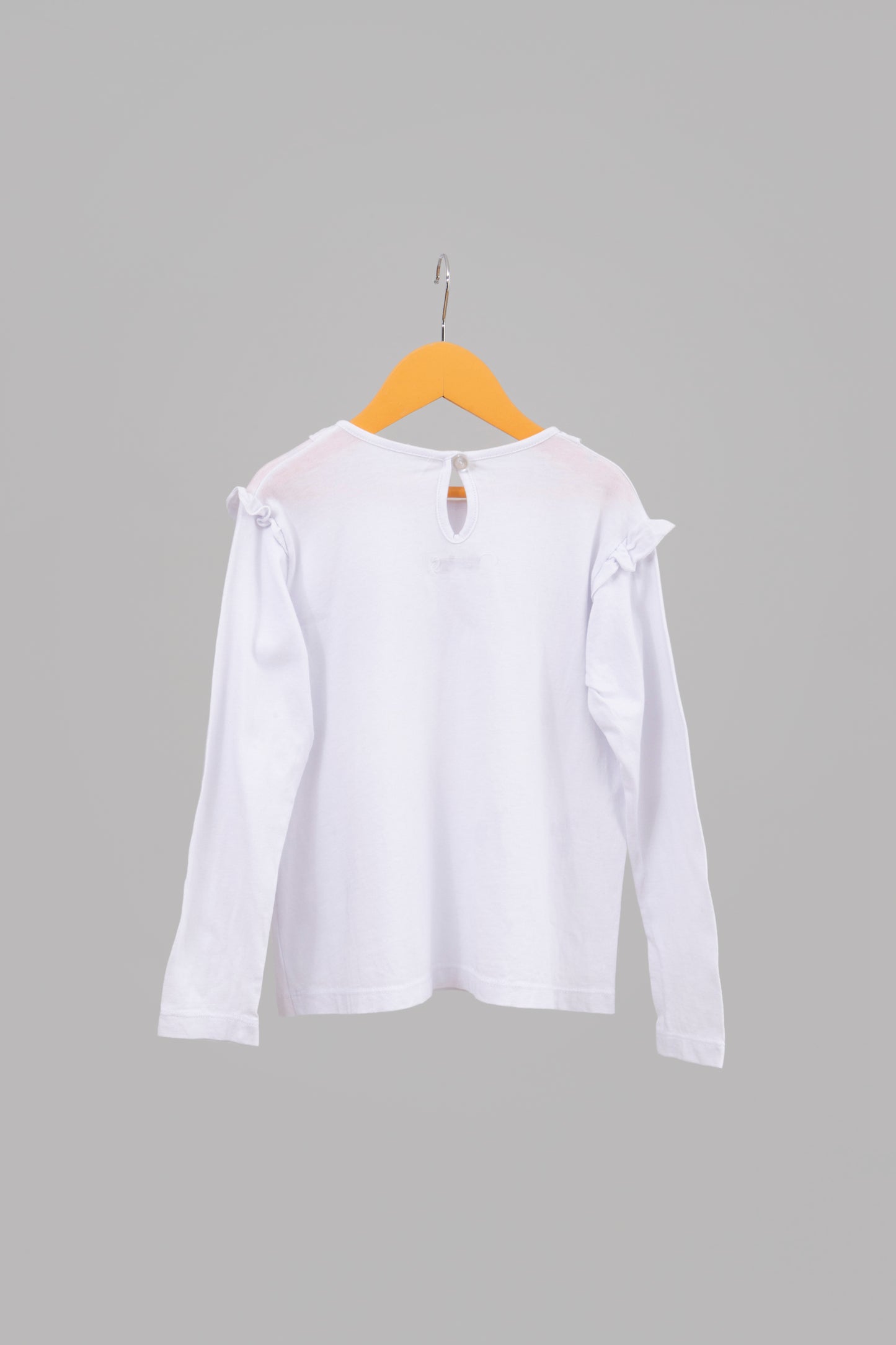 POLERA BLANCA CON VUELOS Y BORDADO PETIT